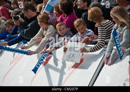 GUILDFORD, UK, 16TH SEP 2012. Young fans prepare to cheer cycling world champion Mark Cavendish along on the Tour of Britain final stage. Stock Photo
