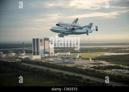 Space Shuttle Endeavour is ferried by NASA's Shuttle Carrier Aircraft September 19, 2012 over the Kennedy Space Center, Cape Canaveral during a farewell tour on the way to permanent display in Los Angeles. Stock Photo