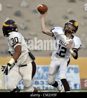 Sept. 20, 2012 - Albuquerque, NM, U.S. - Greg Sorber -- Valley quarterback Bo Coleman, 12,  passes as teammate Esteban Loera, 30, looks back during the game with Eldorado at Wilson Stadium on Thursday, September 20, 2012. (Credit Image: © Greg Sorber/Albuquerque Journal/ZUMAPRESS.com) Stock Photo