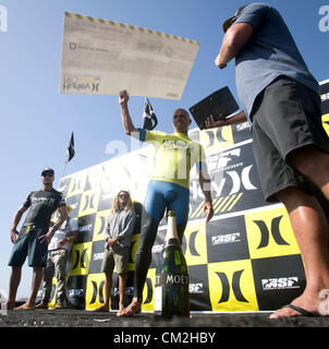 Sept. 20, 2012 - San Clemente, California, USA - KELLY SLATER, of Coco Beach Florida, won the 2012 Hurley Pro at San Onofre State Beach, near San Clemente, California, on Thursday afternoon, September 20, 2012, after a four day battle over 5 days that began Sunday.  In the photo, SLATER holds up a check for over $100,000 dollars as the cash prize for winning the 2012 Hurley Pro. (Credit Image: © David Bro/ZUMAPRESS.com) Stock Photo