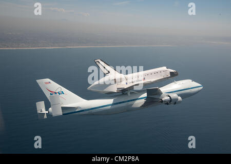 NASA Shuttle Carrier Aircraft carrying space shuttle Endeavour soars over the California coast near Los Angeles, California September 21, 2012 on the last California Tour leg of its ferry flight before becoming a static display in Los Angeles. Stock Photo