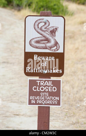 Sept. 4, 2012 - Billings, Montana, USA - September 4, 2012, Billings, Montana - A sign warns visitors of rattlesnakes on the trails of Pictograph Cave State Park in Billings, Montana. The cave contains paintings dating back thousands of years and depicting a wide range of activities. (Credit Image: © David Snyder/ZUMAPRESS.com) Stock Photo