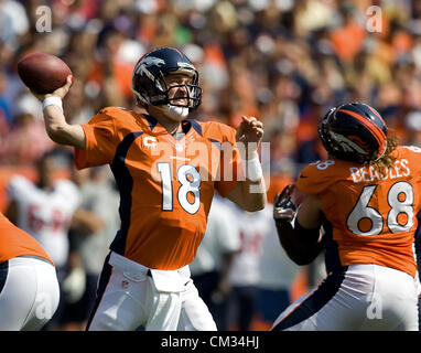 Sept. 23, 2012 - Denver, CO, USA - Broncos QB PEYTON MANNING, left, throws a pass under pressure during the 1st. half at Sports Authority Field at Mile High Sunday afternoon. The Broncos lose to the Texans 31-25. (Credit Image: © Hector Acevedo/ZUMAPRESS.com) Stock Photo