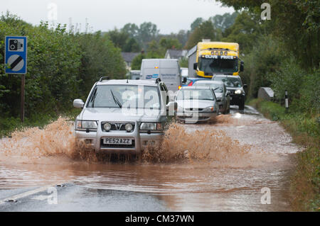 24th September 2012. Herefordshire, UK. Drivers are caught unawares on the A438 Hereford to Brecon road as heavy rainful over the last 24hours causes flash flooding. Photo Credit: Graham M. Lawrence/Alamy Live News. Stock Photo