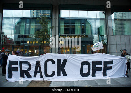 Anti-fracking environmental protestors hold a FrackOff London Chemical Cocktail Party outside the UK Shale Summit meeting. Being held at the Hilton London Metropole Hotel, Edgware Road, London, UK 26 Sept 2012. Stock Photo