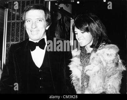 Dec. 20, 1974 - London, England, U.K. - Singer ANDY WILLIAMS with his wife CLAUDINE LONGET at the premiere of the James Bond film, 'The Man with the Golden Gun,' starring Roger Moore at the Odeon Theatre, Leicester Square. (Credit Image: © KEYSTONE Pictures USA/ZUMAPRESS.com) Stock Photo