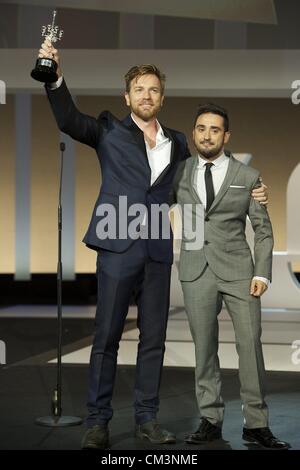 Sept. 27, 2012 - San Sebastian, Euskadi, Spain - Director Juan Antonio Bayona delivers the Donosti Lifetime Achievement Award to Ewan McGregor during 60th San Sebastian International Film Festival at the Kursaal Palace on September 27, 2012 in San Sebastian, Spain. Stock Photo