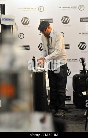 JOHANNESBURG, SOUTH AFRICA - SEPTEMBER 27: A stylist clears up backstage. During the Autumn/Winter Collections 2013, which is part of SA Fashion week, on September 27, 2012 in Johannesburg, South Africa (Photo by Gallo Images / Dino Lloyd) Stock Photo