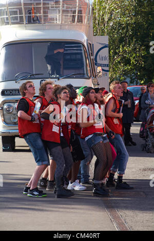 Bournemouth, UK Saturday 29 September 2012. Opening day of the Bournemouth Arts by the Sea Festival - the Big Issue Vendor Flash Mob perform. Lee Hart, Director of Salt Factory, worked with local Big Issue vendors to develop choreography which tells their stories. Stock Photo