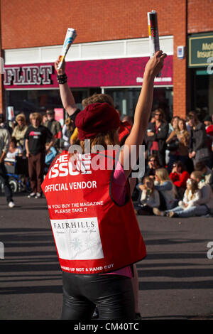 Bournemouth, UK Saturday 29 September 2012. Opening day of the Bournemouth Arts by the Sea Festival - the Big Issue Vendor Flash Mob perform. Lee Hart, Director of Salt Factory, worked with local Big Issue vendors to develop choreography which tells their stories. Stock Photo