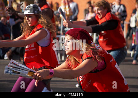 Bournemouth, UK Saturday 29 September 2012. Opening day of the Bournemouth Arts by the Sea Festival - the Big Issue Vendor Flash Mob perform. Lee Hart, Director of Salt Factory, worked with local Big Issue vendors to develop choreography which tells their stories. Stock Photo