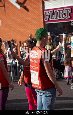 Bournemouth, UK Saturday 29 September 2012. Opening day of the Bournemouth Arts by the Sea Festival - the Big Issue Vendor Flash Mob perform. Lee Hart, Director of Salt Factory, worked with local Big Issue vendors to develop choreography which tells their stories. Stock Photo