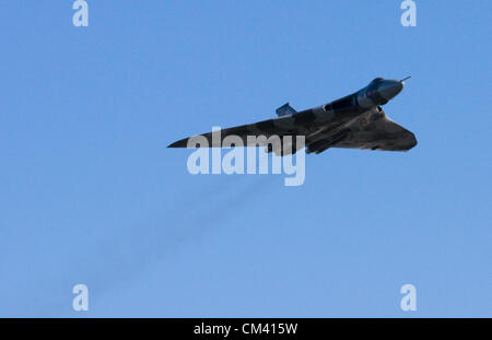 Restored Vulcan Bomber XH558 does a flypast at Filton Airfield Bristol on 29th September 2012. This last flying example of Britain's cold war nuclear deterrent pleased aviation fans all over the country by visiting many of the locations where it's components were manufactured. The Olympus engines, similar to the ones used on Concord were manufactured at the Rolls Royce factory in Filton, Bristol. Stock Photo