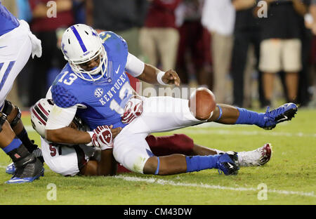 September 29, 2012 - Lexington, Kentucky, USA - UK quarterback Jalen Whitlow loses the ball as he is hit by a South Carolina defender as the University of Kentucky plays South Carolina at Commonwealth Stadium. South Carolina won the game 38-17. (Credit Image: © David Stephenson/ZUMAPRESS.com) Stock Photo