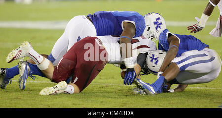 September 29, 2012 - Lexington, Kentucky, USA - South Carolina quarterback Connor Shaw is brought down by UK's Alvin Dupree, left, and Cody Quinn as the University of Kentucky plays South Carolina at Commonwealth Stadium. South Carolina won the game 38-17. (Credit Image: © David Stephenson/ZUMAPRESS.com) Stock Photo