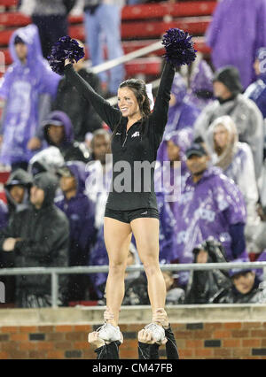 Sept. 29, 2012 - Dallas, Texas, United States of America - TCU Horned Frogs cheerleaders in action during heavy rainfall in the game between the Southern Methodist Mustangs and the TCU Horned Frogs at the Gerald J. Ford Stadium in Dallas, Texas. TCU defeats SMU 24 to 16. (Credit Image: © Dan Wozniak/ZUMAPRESS.com) Stock Photo