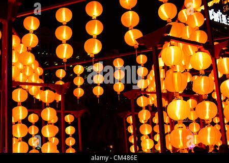 Hong Kong. 30th October 2012. Mid Autumn festival also known as the Moon festival and Lantern festival was celebrated in Hong Kong. Lanterns were lit and people stayed up celebrating with their families into the night eating moon cakes. Stock Photo