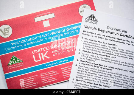 Replacement V5C documents are arriving through the post for all car owners in Britain - at an estimated cost of £200m. A theft of blue printed forms back in 2006 forced the vehicle licencing authority to replace every single existing document and change to a new red version. The cost is five times the estimated taxpayer burden of the West Coast Rail Line bidding process failure. Stock Photo