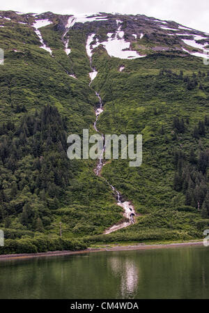 July 5, 2012 - Borough Of Juneau, Alaska, US - A stream fed by melting snow from one of the mountains in the Tongass National Forest flows into Gastineau Channel near Juneau. (Credit Image: © Arnold Drapkin/ZUMAPRESS.com) Stock Photo