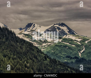 July 5, 2012 - Borough Of Juneau, Alaska, US - Dramatic snow covered mountains, part of the Tongass National Forest, seen from the Gastineau Channel near Juneau, Alaska. (Credit Image: © Arnold Drapkin/ZUMAPRESS.com) Stock Photo