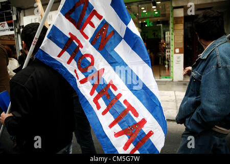 Thessaloniki, Greece. 9th October 2012. Protester holding a Greek flag that reads 'Not for Sale'. Labor unions and opposition parties in debt-stricken Greece, organize demonstrations in the northern Greece city of Thessaloniki to protest against a planned 6-hour-visit by German Chancellor Angela Merkel today in Athens. Credit:  Konstantinos Tsakalidis / Alamy Live News Stock Photo