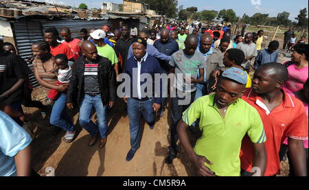 JOHANNESBURG, SOUTH AFRICA: Expelled ANC Youth League leader Julius Malema arrives in Slovo Park informal settlement on October 10, 2012 in Johannesburg, South Africa. The residents invited Malema to address them. (Photo by Gallo Images / Foto24 / Felix Dlangamandla) Stock Photo