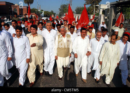 Khyber Pakhtoonkhawa Local Government and Rural  Development Minister, Bashir Bilour leads a protest rally against attack on Malala Yousaf Zai  arranges by Awami National Party in Peshawar on Thursday, October 11, 2012. Malala Yousaf  Zai, a child rights activist and National Peace Award winner, was critically injured, along with  another girl student, after a gunman shot her on Tuesday in Mingora town of district Swat while  she returning home from school on a van. According to senior doctor Malala Yousaf Zai was still  in a critical condition on Wednesday after su Stock Photo