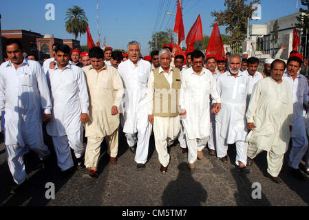 Khyber Pakhtoonkhawa Local Government and Rural  Development Minister, Bashir Bilour leads a protest rally against attack on Malala Yousaf Zai  arranges by Awami National Party in Peshawar on Thursday, October 11, 2012. Malala Yousaf  Zai, a child rights activist and National Peace Award winner, was critically injured, along with  another girl student, after a gunman shot her on Tuesday in Mingora town of district Swat while  she returning home from school on a van. According to senior doctor Malala Yousaf Zai was still  in a critical condition on Wednesday after su Stock Photo