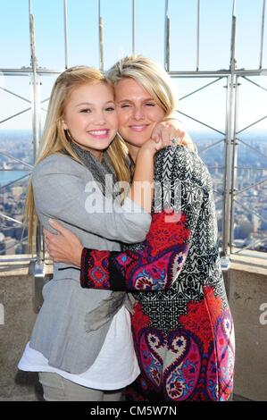 Oct. 11, 2012 - Manhattan, New York, U.S. - OLIVIA HOLT, with her mom KIM HOLT, best known for her starring role in Disney XD's ''Kickin' It'', tours the Empire State Building's 86th floor Observatory October 11, 2012, to promote the upcoming Disney Channel Original Movie, Girl vs. Monster. Olivia stars as 'Skylar' in the Halloween-themed original movie about a teenage girl who discovers the family secret that she is a fifth generation monster hunter. (Credit Image: © Bryan Smith/ZUMAPRESS.com) Stock Photo