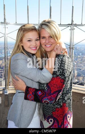 Oct. 11, 2012 - Manhattan, New York, U.S. - OLIVIA HOLT, with her mom KIM HOLT, best known for her starring role in Disney XD's ''Kickin' It'', tours the Empire State Building's 86th floor Observatory October 11, 2012, to promote the upcoming Disney Channel Original Movie, Girl vs. Monster. Olivia stars as 'Skylar' in the Halloween-themed original movie about a teenage girl who discovers the family secret that she is a fifth generation monster hunter. (Credit Image: © Bryan Smith/ZUMAPRESS.com) Stock Photo