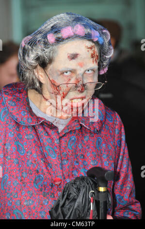 Southbank, London, UK. 13th October 2012. An Old Lady 'Zombie'. World Zombie Day, a Zombie themed pub crawl through central London. Hundreds of people dressed as Zombies make their way through London on a day long charity pub crawl. Stock Photo
