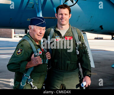 Retired United States Air Force Brig. Gen. Chuck Yeager, 89, with Air Force pilot Capt. David Vincent before boarding an F-15D Eagle fighter aircraft to celebrate the 65th anniversary of becoming the first person to break the sound barrier October 14, 2012, at Nellis Air Force Base, Nevada. In 1947 Yeager broke the sound barrier in a Bell XS-1 rocket research plane named Glamorous Glennis. Stock Photo