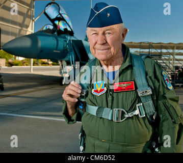 Retired United States Air Force Brig. Gen. Chuck Yeager, 89, smiles before boarding an F-15D Eagle fighter aircraft to celebrate the 65th anniversary of becoming the first person to break the sound barrier October 14, 2012, at Nellis Air Force Base, Nevada. In 1947 Yeager broke the sound barrier in a Bell XS-1 rocket research plane named Glamorous Glennis. Stock Photo