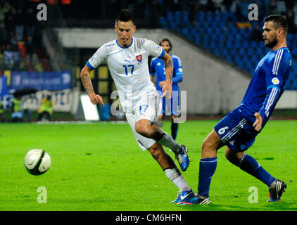 Bratislava, Slovakia. 16th October 2012. Slovak national team player Marek Hamsik, left, is challenged by Alexandros Tziolis, right, of Greece for the ball during a World Cup 2014 Group G qualification match between Slovakia and Greece in Bratislava, Slovakia, Tuesday, Oct. 16, 2012. (CTK Photo/Jan Koller) Stock Photo