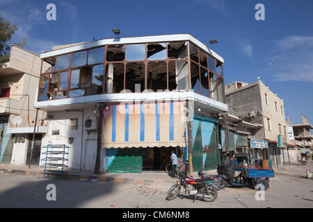 Azaz, Syria. 17th October 2012. A man enters a shop with destroyed windows in A'zaz, Syria on October 17, 2012. Credit:  PixelPro / Alamy Live News Stock Photo