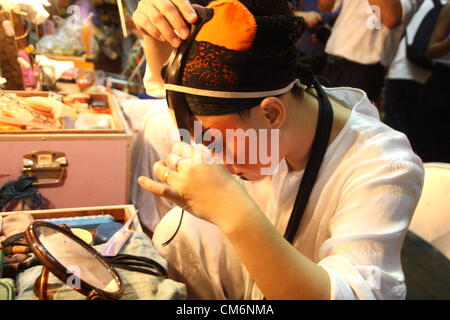 Oct. 17, 2012 . Bangkok . Thailand . Performer prepares make up , Back stage with Chinese opera performers at a Chinese god shrine in Thailand's vegetation festival 2012, celebrated from the 14th to 24th October 2012. Credit:  John Vincent / Alamy Live News Stock Photo