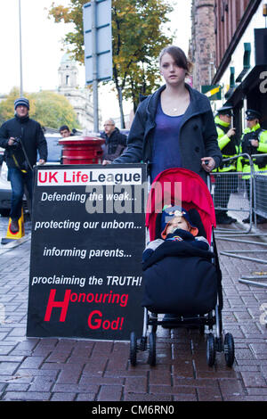 Belfast, UK. 18th October, 2012. Mother with her young son protests against the opening of a Marie Stopes clinic, the private first clinic in Northern ireland to offer abortions. The clinic, which opened today, offers abortions under the law in Northern Ireland. Stock Photo