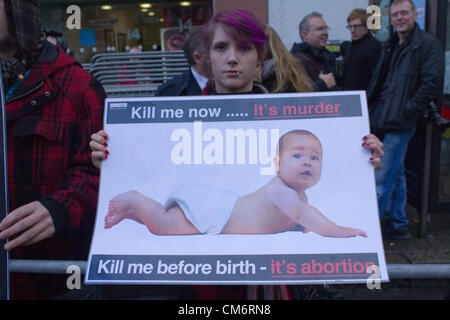 Belfast, UK. 18th October, 2012. Protester holding an anti-abortion banner at the opening of the new Marie Stopes clinic in Belfast, the first private clinic in Northern ireland to offer abortions. The clinic, which opened today, offers abortions under the law in Northern Ireland. Stock Photo