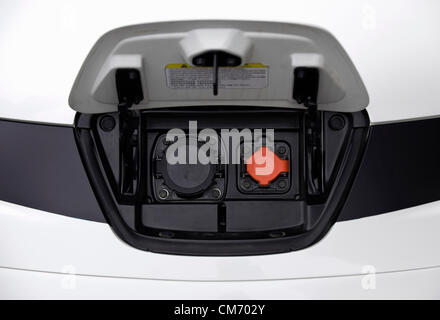 Photo shows the charging point located in the front of a prototype of Nissan's e-NV200 electric vehicle during a test run at the automaker's Oppama test circuit in Yokohama, Japan on 17 Oct. 2012.  Photographer: Robert Gilhooly Stock Photo