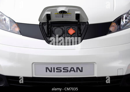 Photo shows the charging point located in the front of a prototype of Nissan's e-NV200 electric vehicle during a test run at the automaker's Oppama test circuit in Yokohama, Japan on 17 Oct. 2012.  Photographer: Robert Gilhooly Stock Photo