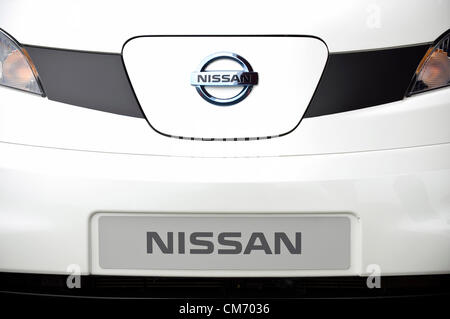 Photo shows the cover of the charging point located in the front of a prototype of Nissan's e-NV200 electric vehicle during a test run at the automaker's Oppama test circuit in Yokohama, Japan on 17 Oct. 2012.  Photographer: Robert Gilhooly Stock Photo