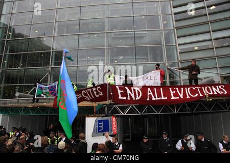 London, UK. 19th October 2012 A demonstration organised by the Traveller Solidarity Network targeted Eric Pickles Department for Communities and Local Government. Some protestors climbed onto the entrance of the building while others struggled with police. Stock Photo