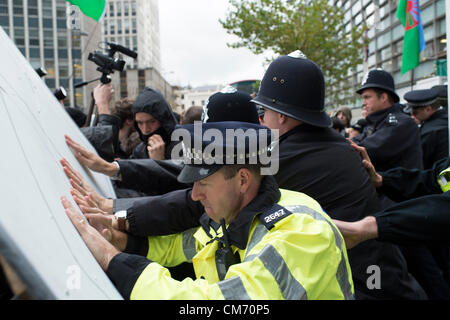 Victoria, London, UK. 19th October 2012. One year on after the forced eviction of Dale Farm Travellers site in Basildon Essex, supporters attended the Office of Eric Pickles MP. The intention was to evict him but they were met by a contingent of police to prevent entry. Violence soon erupted. Credit:  Allsorts Stock Photo / Alamy Live News Stock Photo