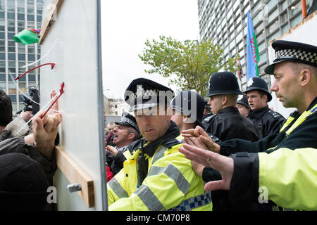 Victoria, London, UK. 19th October 2012. One year on after the forced eviction of Dale Farm Travellers site in Basildon Essex, supporters attended the Office of Eric Pickles MP. The intention was to evict him but they were met by a contingent of police to prevent entry. Violence soon erupted. Credit:  Allsorts Stock Photo / Alamy Live News Stock Photo