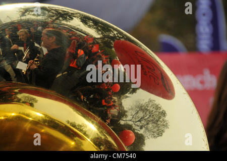 Embankment, London, UK. 20th October 2012. A Unite union ballon is reflected in a brass band players instrument as the marchers assemble on the Embankment. TUC anti-austerity march through London. Organised by the TUC, with members from different unions march against the coalition governments austerity plan. Credit:  Matthew Chattle / Alamy Live News Stock Photo