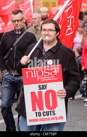 Belfast, UK. 20th October 2012. Demonstrator holds a NIPSA poster saying 'NIPSA say no to cuts' as ICTU hold an anti-austerity rally in Belfast. Credit:  Stephen Barnes / Alamy Live News Stock Photo