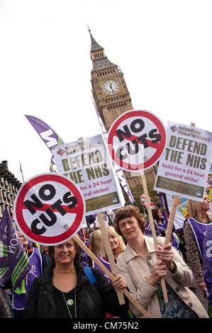 London, UK - 20 October 2012: two women hold signs reading 'No Cuts' and 'Defend the NHS' during the TUC-organised march 'A future that works' against austerity cuts in central London. Stock Photo