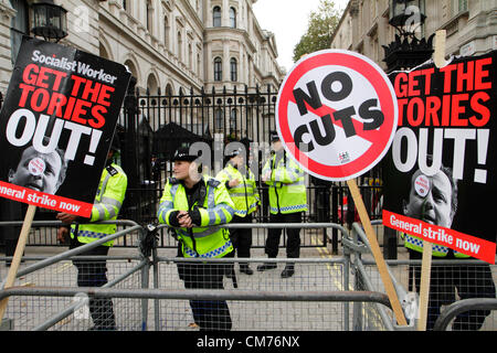 Anti-government placards at the entrance of Downing Street during the TUC anti-austerity march. London.  20th. October 2012 Stock Photo