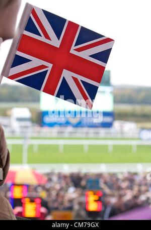 Ascot, UK. 20th October, 2012. A racing fan waves the Union Jack on British Champions Day at Ascot Stock Photo