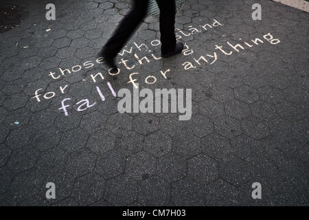 October 22, 2012, New York, NY, US.  At Union Square, a slogan written on the sidewalk reads 'those who stand for nothing fall for anything' ; demonstrators there were marking the 17th National Day of Protest to Stop Police Brutality Stock Photo